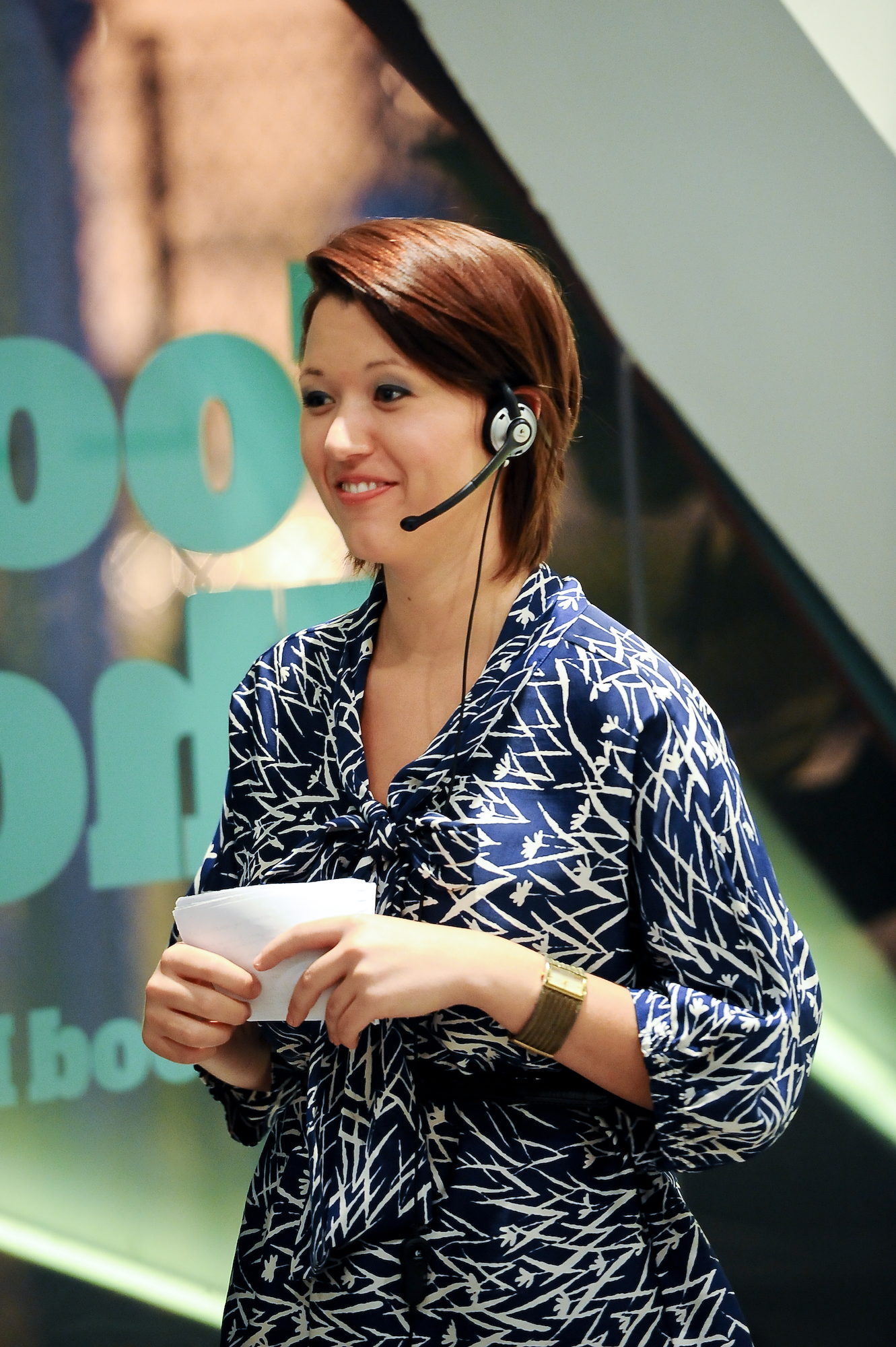 Woman with a microphone & earpiece