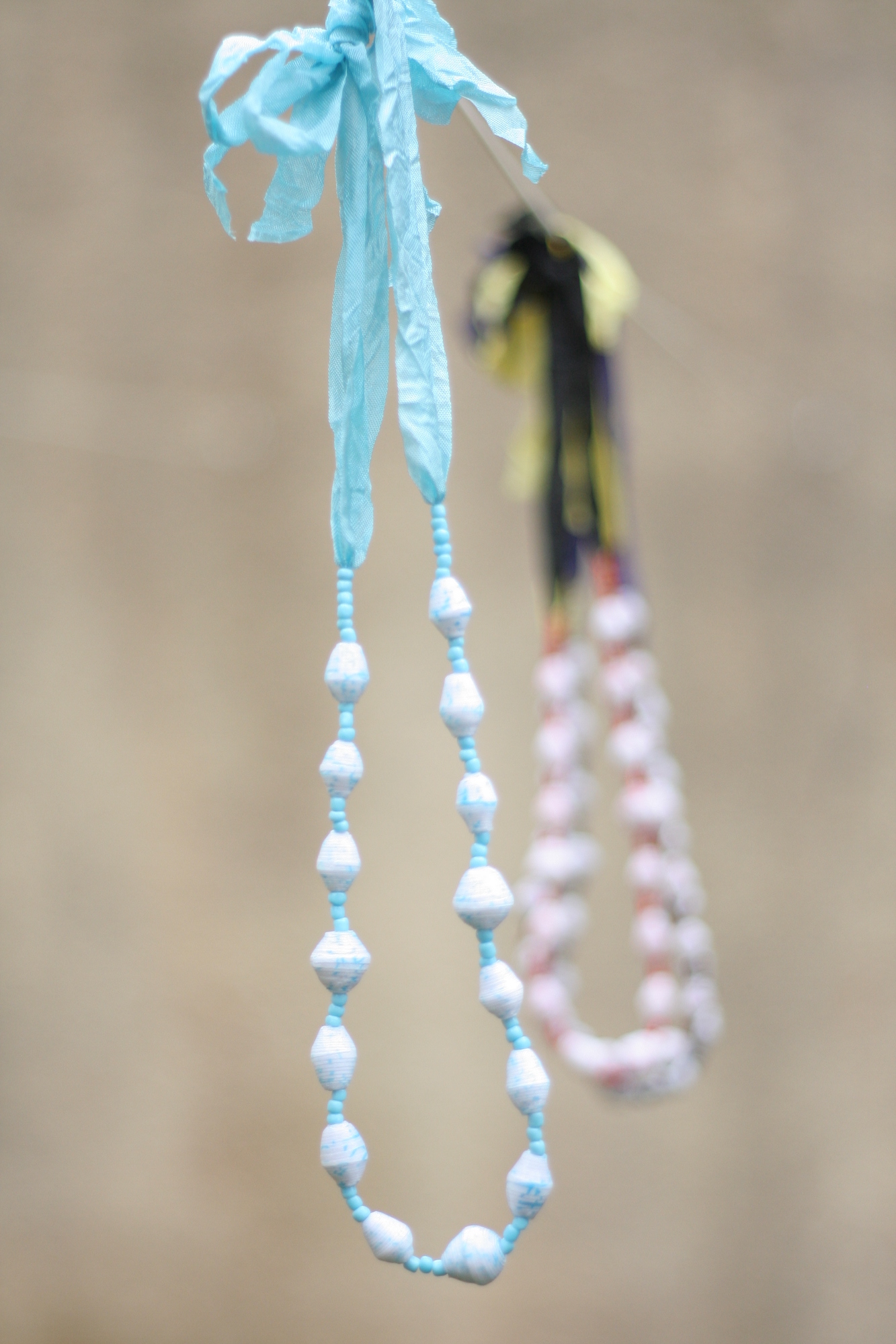 Beaded necklace, white beads on blue ribbon