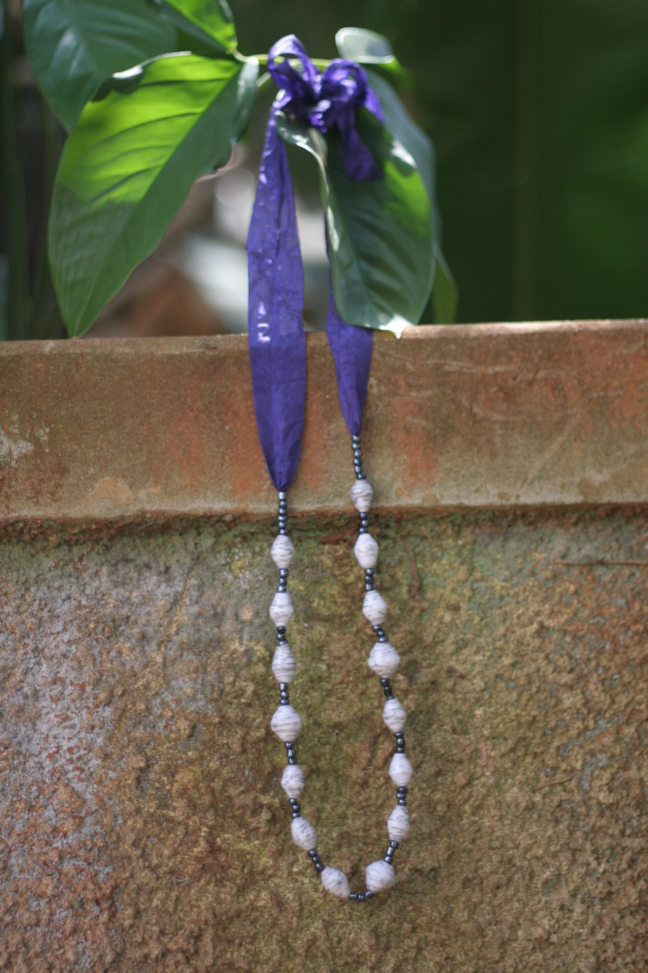 Beaded necklace, white beads on purple ribbon