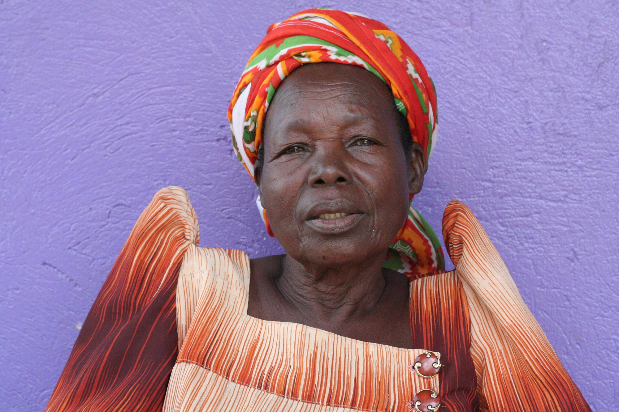 Woman in front of a purple wall