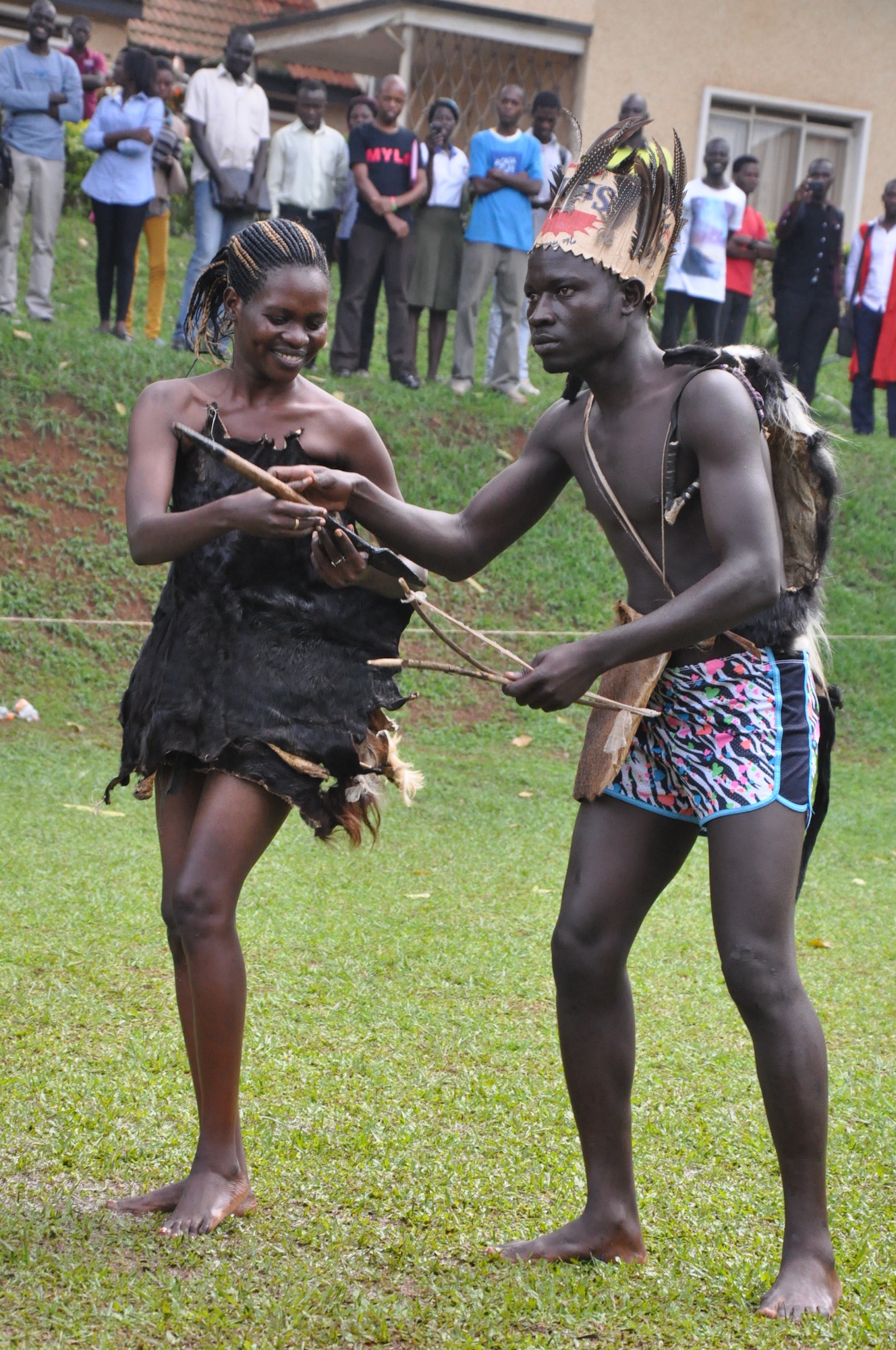 Acholi couple in traditional dress preparing to dance