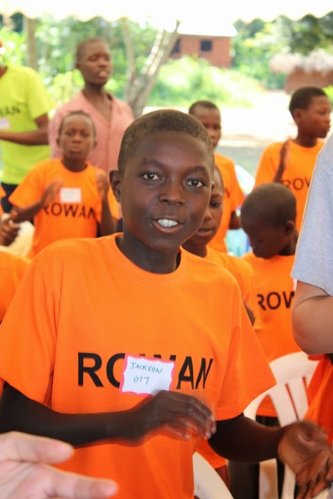 Young boy in a bright orange t-shirt