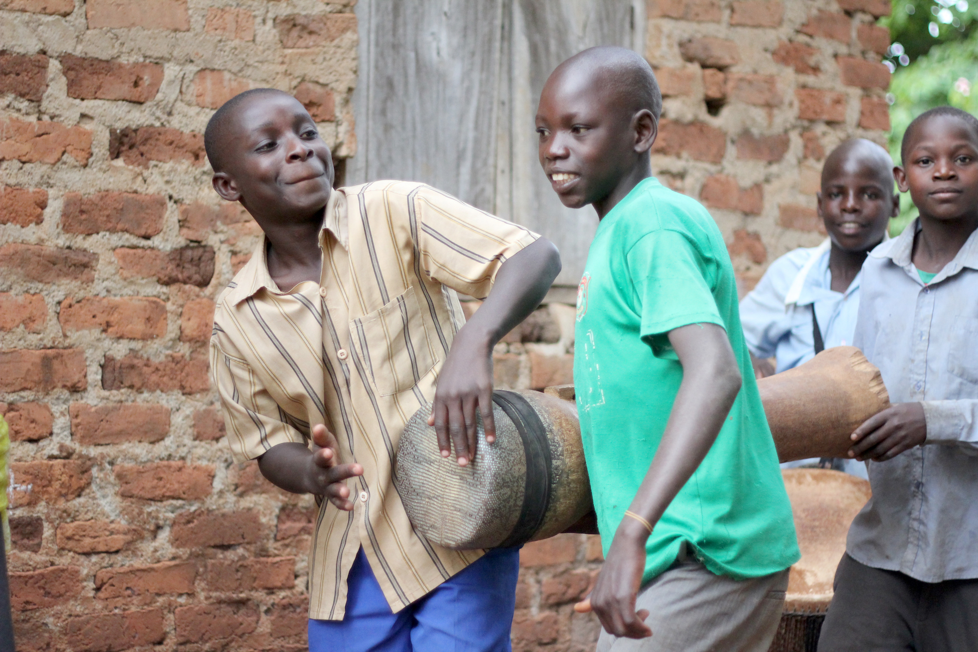 Two boys playing drums & dancing