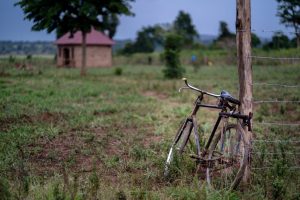 Bike leaning against in fence in Uganda