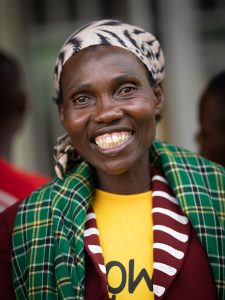 A happy woman smiling in Uganda