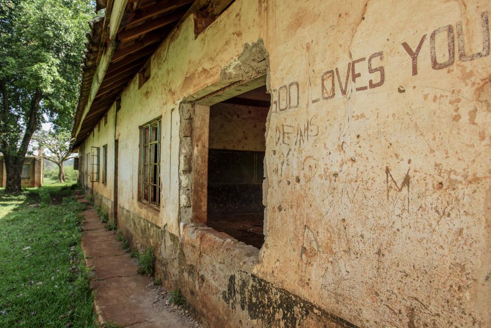 An empty school building with missing windows in Uganda